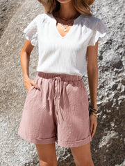 Pantalones cortos informales de verano de algodón verde con cintura elástica, dobladillo enrollado y bolsillos inclinados para mujer de Emery Rose