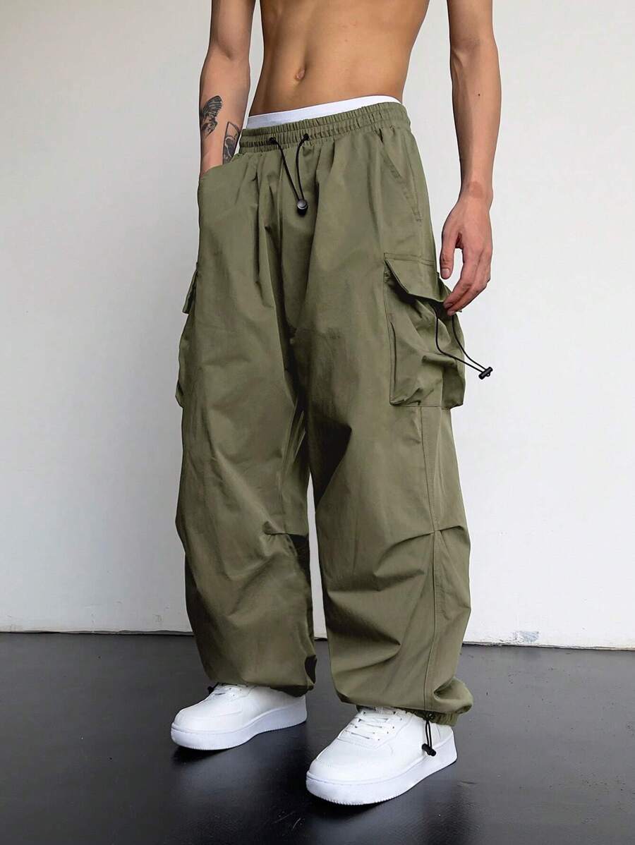 Pantalones cargo holgados extragrandes Manfinity EMRG para hombre con bolsillo de solapa y cordón lateral en la cintura