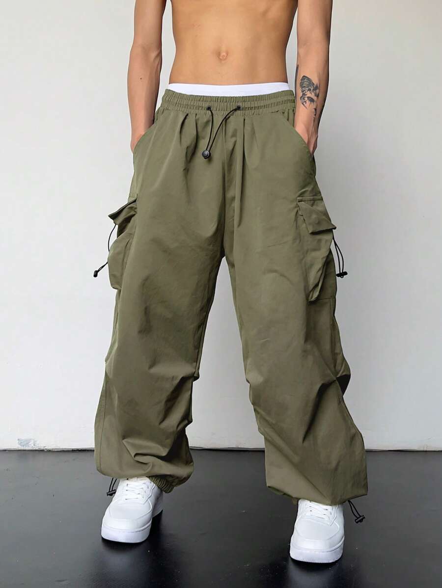Pantalones cargo holgados extragrandes Manfinity EMRG para hombre con bolsillo de solapa y cordón lateral en la cintura