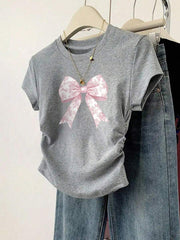 Camiseta informal minimalista con lazo rosa y volantes en la cintura para niña preadolescente de Wildeya