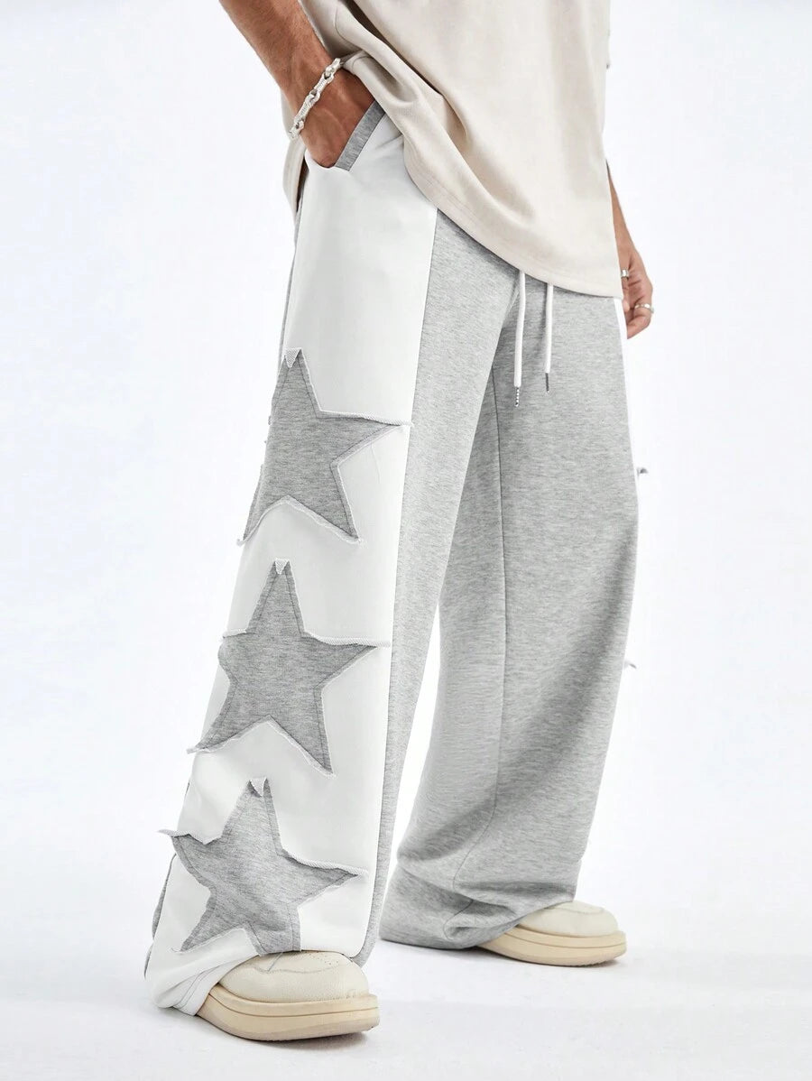 Pantalones deportivos largos, holgados y de pierna ancha con parches de doble estrella para hombre de AXEPEAK