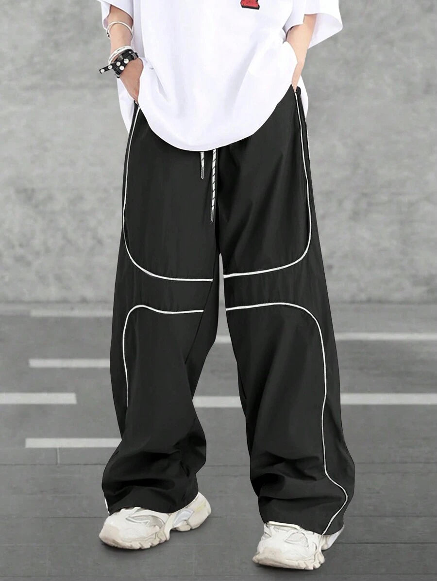 Pantalones extragrandes con cintura con cordón y ribete en contraste para hombre de Manfinity Hypemode