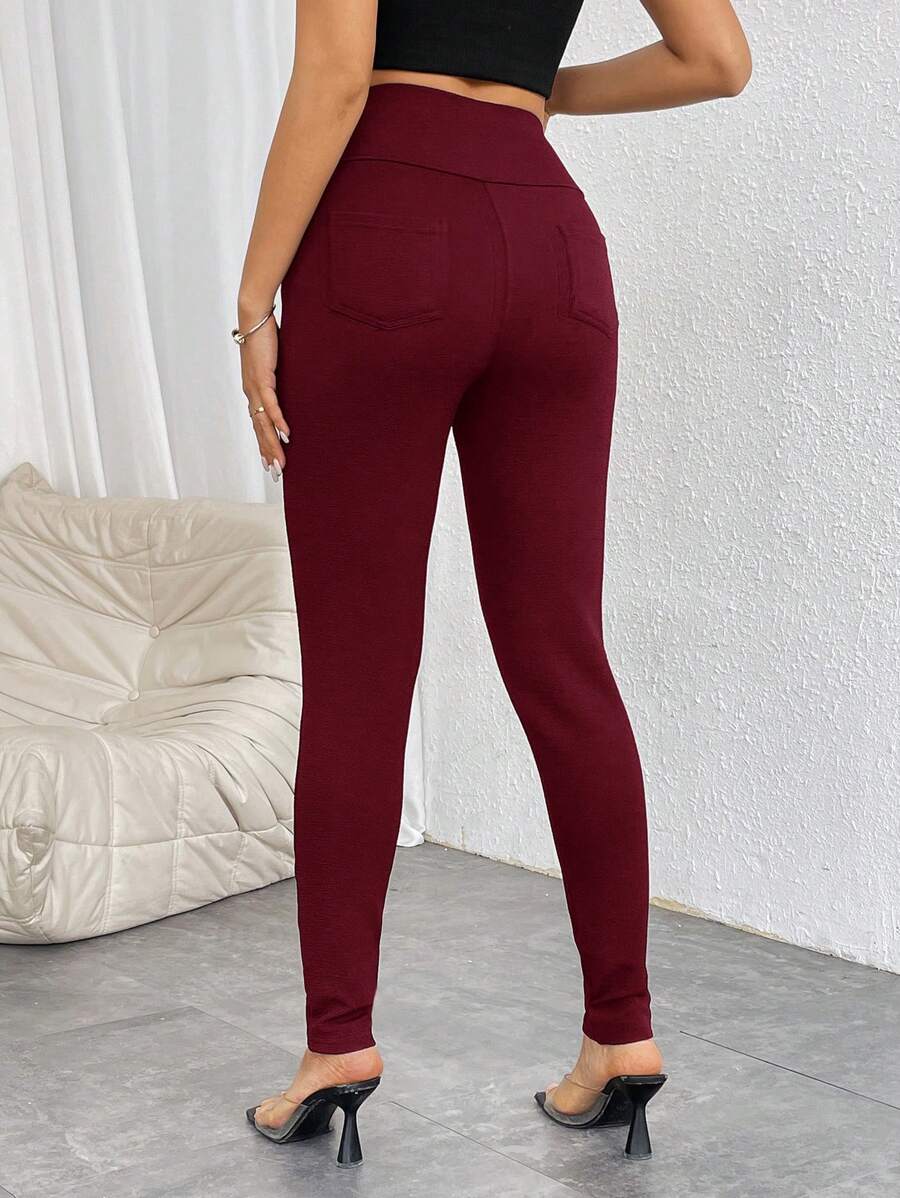 Pantalones casuales ajustados de cintura alta con cremallera y botones frontales de color liso para mujer de Firerie