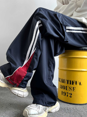 Pantalones casuales a rayas estilo universitario americano TECCULI para hombre, pantalones deportivos holgados de pierna ancha estilo retro de calle de marca de moda de primavera