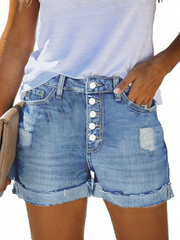 Shorts estilo mezclilla lavada azul con diseño de botones delanteros y dobladillo deshilachado estilo TECCULI