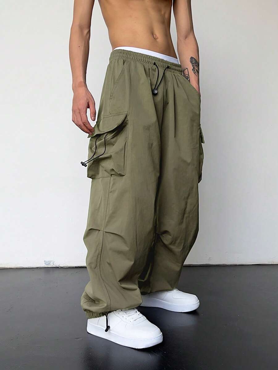 Pantalones cargo holgados extragrandes Manfinity EMRG para hombre con bolsillo de solapa y cordón lateral en la cintura