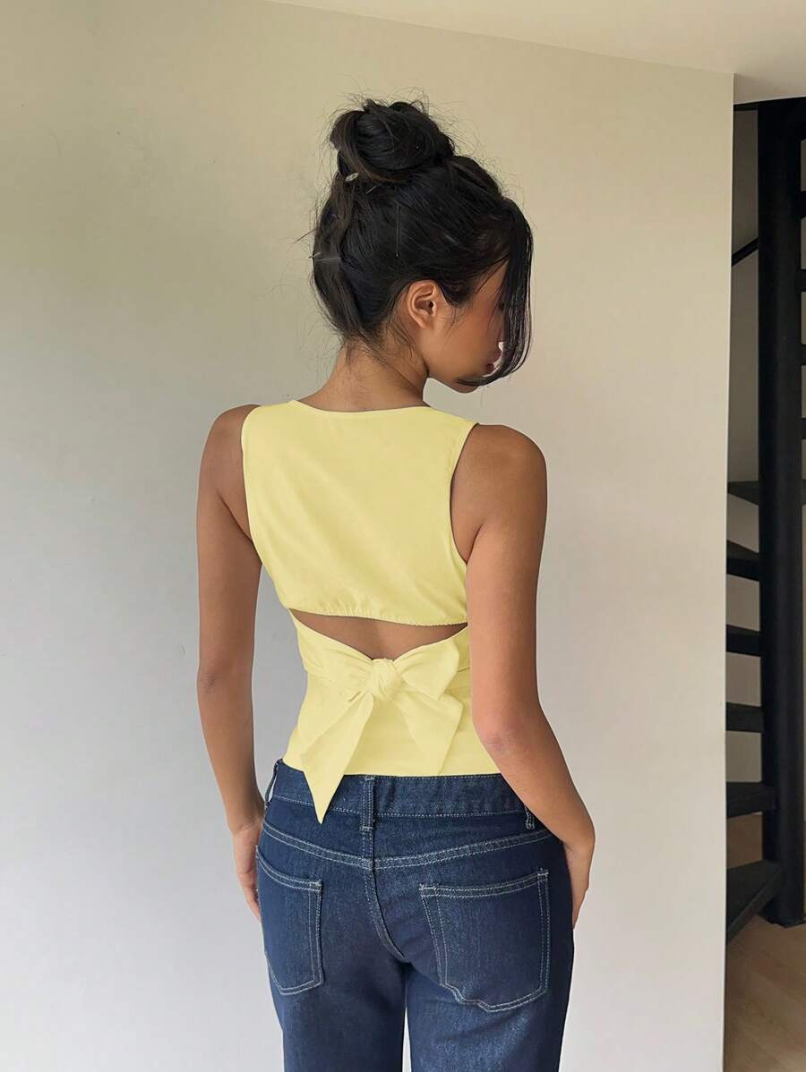 Blusa negra sin mangas con cuello redondo, lazo y espalda descubierta para mujer de Aloruh