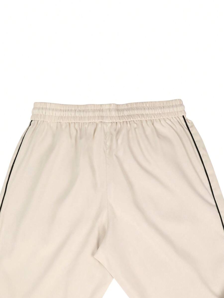 Pantalones extragrandes con cintura con cordón y ribete en contraste para hombre de Manfinity Hypemode