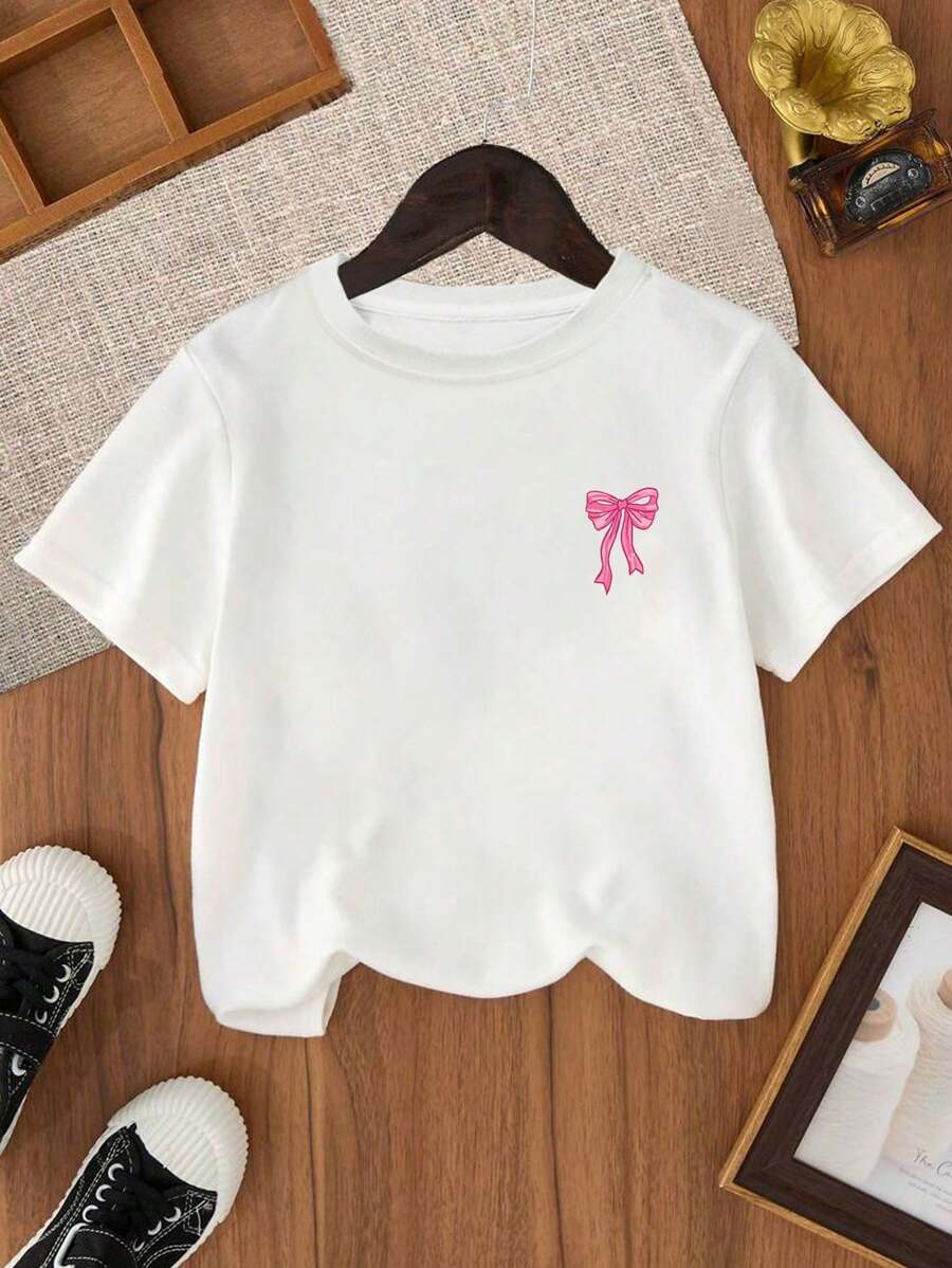 Camiseta de manga corta con cuello redondo y estampado de lazo de dibujos animados para niñas preadolescentes, informal, para primavera y verano.