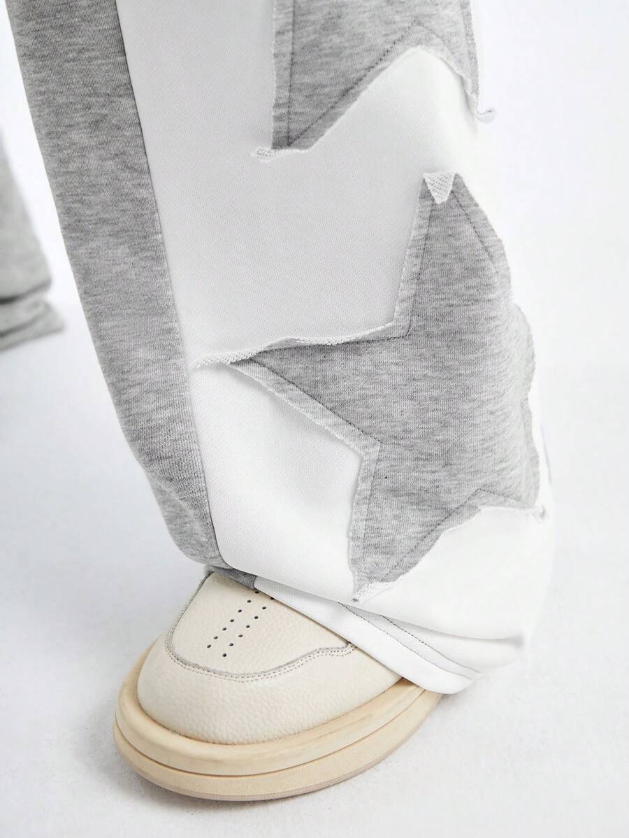 Pantalones deportivos largos, holgados y de pierna ancha con parches de doble estrella para hombre de AXEPEAK