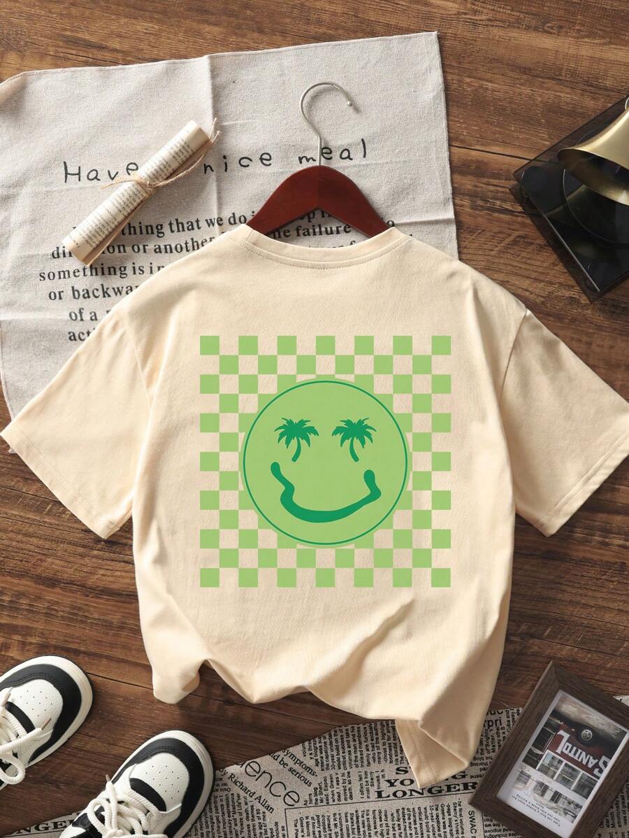 Camiseta de manga corta con estampado de palmera y cara sonriente para niño preadolescente, ideal para jugar en la playa.