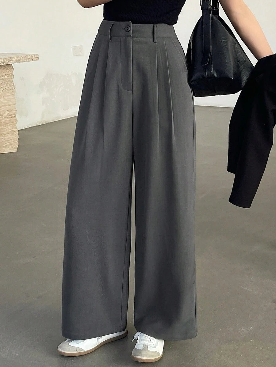 Pantalones de traje holgados plisados informales con bolsillo frontal y botones de color liso para mujer de DAZY, pantalones de vestir para mujer