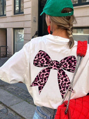 Camiseta de manga corta extragrande con estampado de leopardo y lazo para niña preadolescente, cómoda y moderna para el verano.