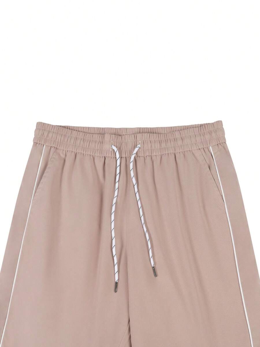 Pantalones extragrandes con cintura con cordón y ribete en contraste para hombre de Manfinity Hypemode