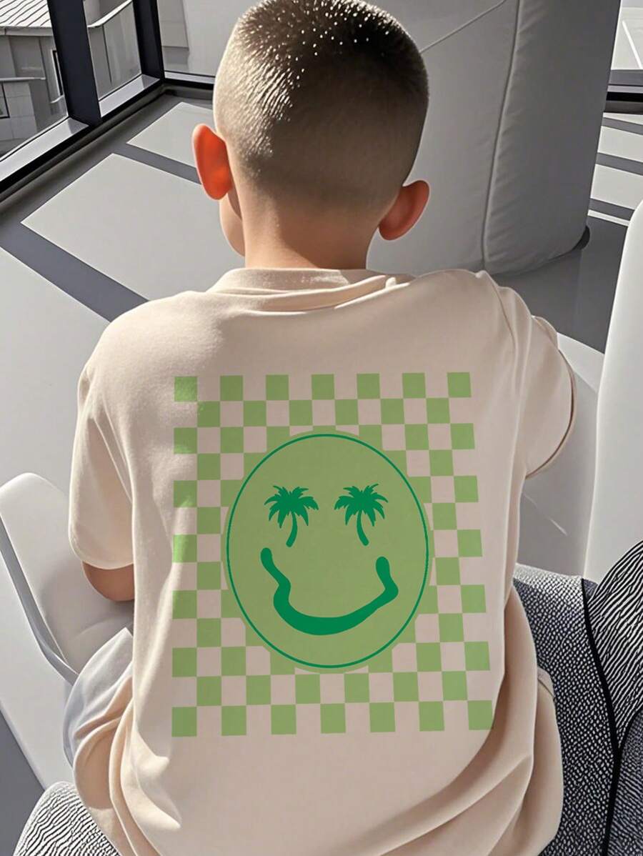 Camiseta de manga corta con estampado de palmera y cara sonriente para niño preadolescente, ideal para jugar en la playa.