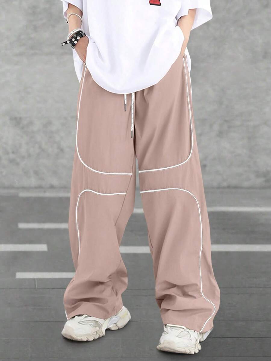 Pantalones extragrandes con cintura con cordón y ribete en contraste para hombre de Manfinity Hypemode