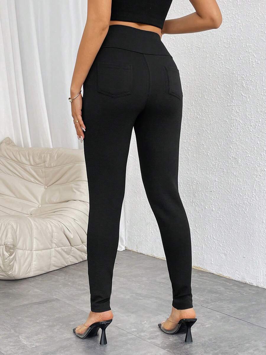 Pantalones casuales ajustados de cintura alta con cremallera y botones frontales de color liso para mujer de Firerie
