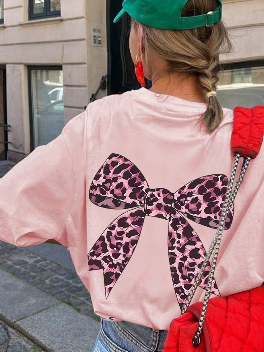 Camiseta de manga corta extragrande con estampado de leopardo y lazo para niña preadolescente, cómoda y moderna para el verano.