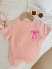 Camiseta de manga corta con cuello redondo y estampado de lazo de dibujos animados para niñas preadolescentes, informal, para primavera y verano.