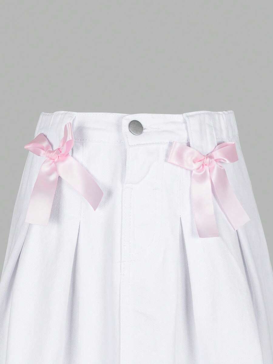 Falda vaquera lavada plisada azul claro, informal, versátil y de moda para niñas preadolescentes con lazo rosa