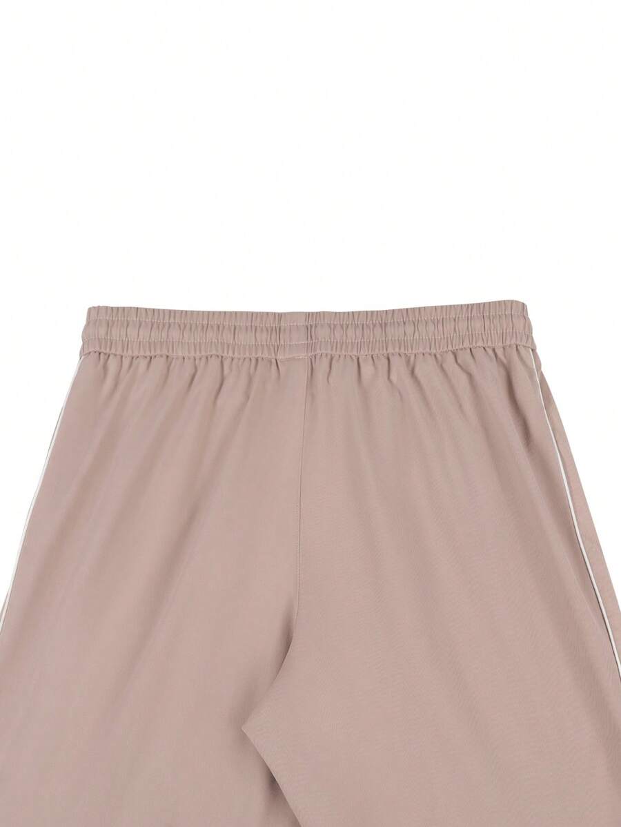Pantalones extragrandes con cintura con cordón y ribete en contraste para hombre de Manfinity Hypemode