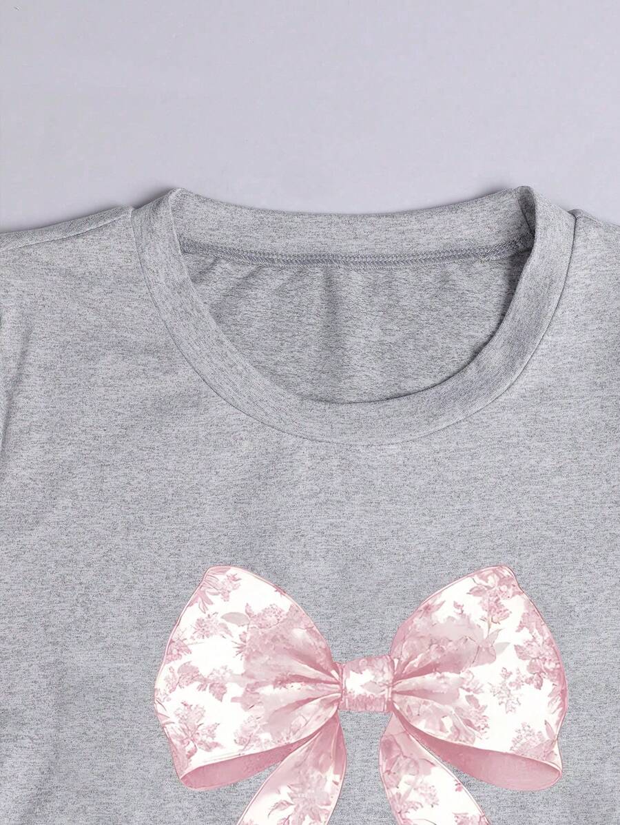 Camiseta informal minimalista con lazo rosa y volantes en la cintura para niña preadolescente de Wildeya